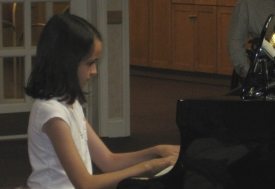 catholic-care-student-at-piano