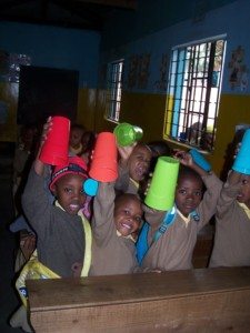 Students in Tanzania Africa learning English and Rhythm Cup Explorations!