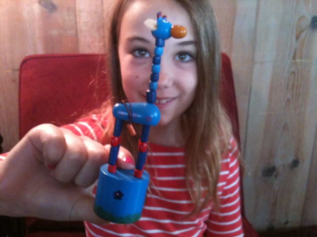 Piano student using giraffe to show good hand position