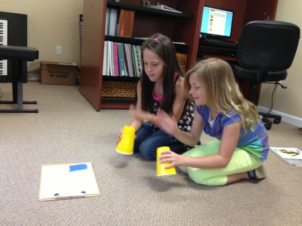 How to use Parent Pages. Rhythm Cups being used during a bring a friend lesson