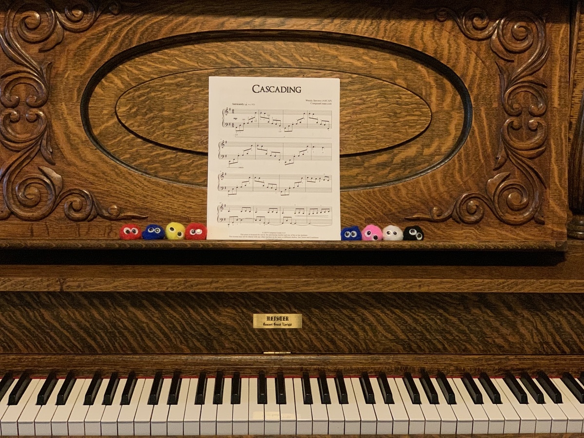 Use Little Fuzzies to Make Learning Fun! Little Fuzzies on piano next to music. 