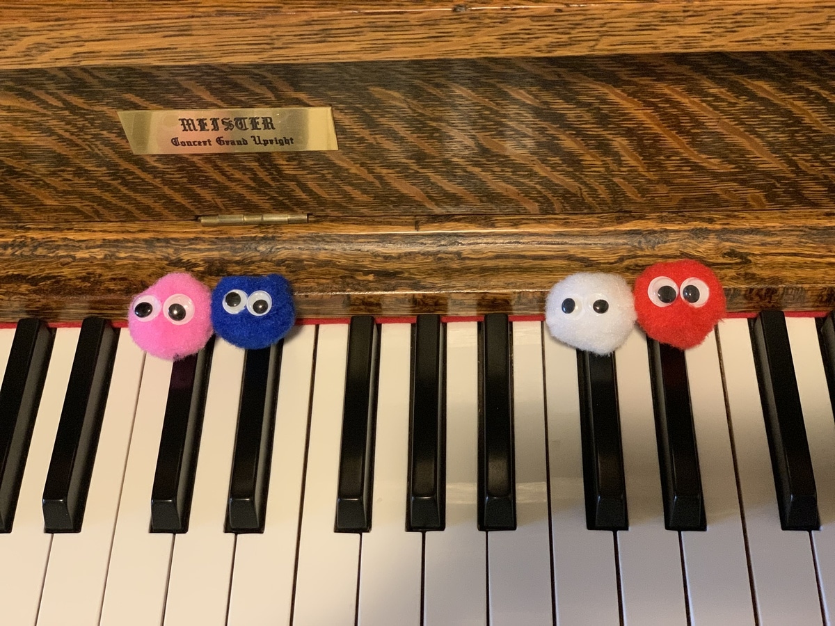 Use Little Fuzzies to Make Learning Fun! Little Fuzzies on piano black keys 