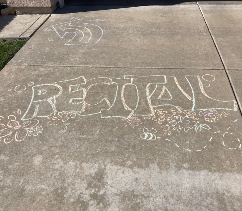 Art & Music Recital sidewalk chalk to direct people to backyard where art is | ComposeCreate.com
