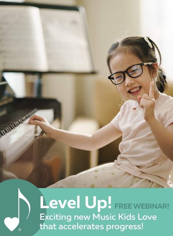 Free Webinar: Level Up! | A smiling child piano student is at the piano, with one hand on the keys, and the other hand gesturing "#1!" | ComposeCreate.com