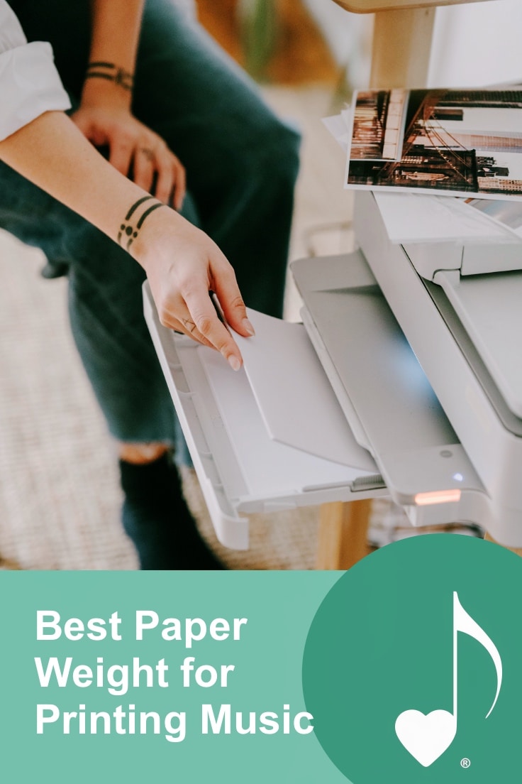 Best Paper Weight for Printing Music, Achievement Cards and more! ComposeCreate.com | The image is of a person reloading paper into a home printer.