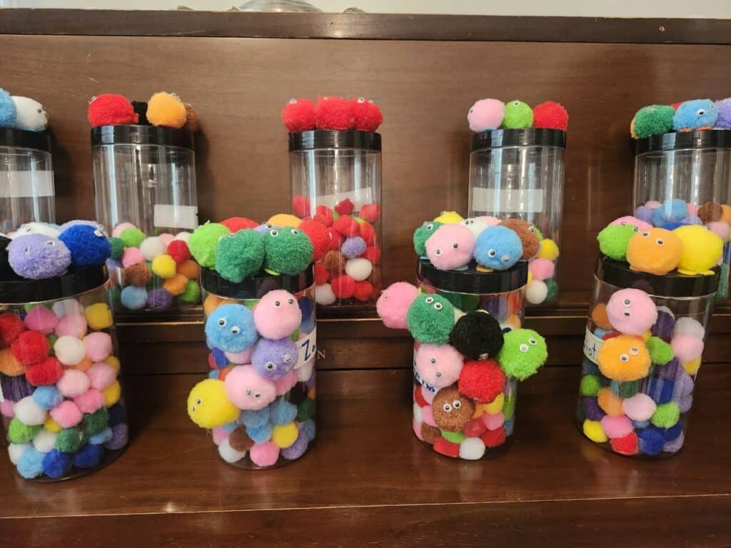 Little Fuzzies Challenge Program: Picture of jars filled with Little Fuzzies!